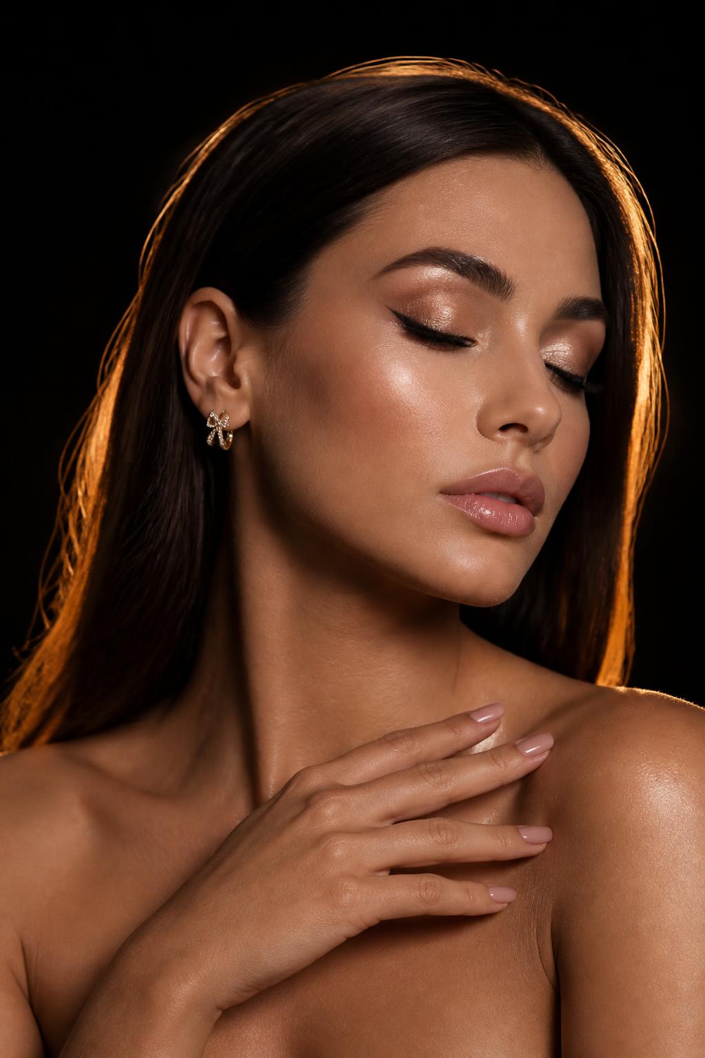 Beauty portrait with styled hair and glowing makeup